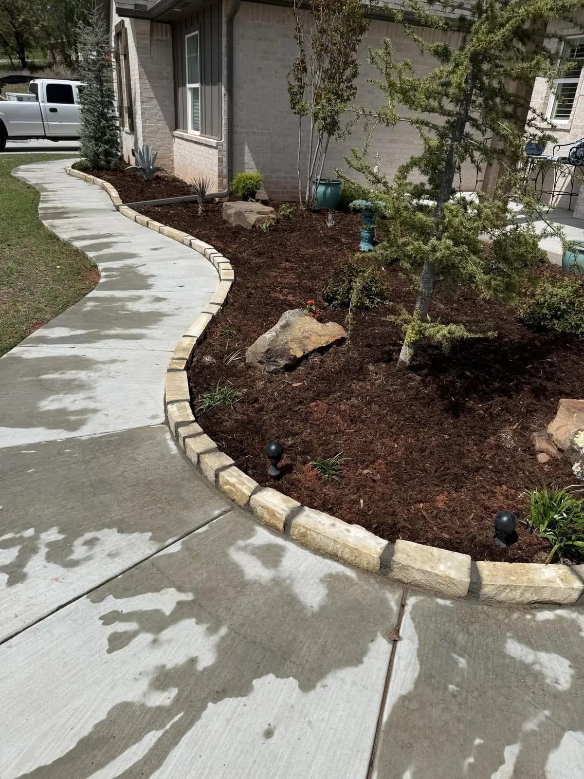 Finished Greenline landscape bed along a residential walkway